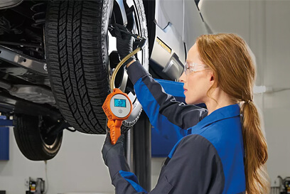 Subaru Certified technician working ona car